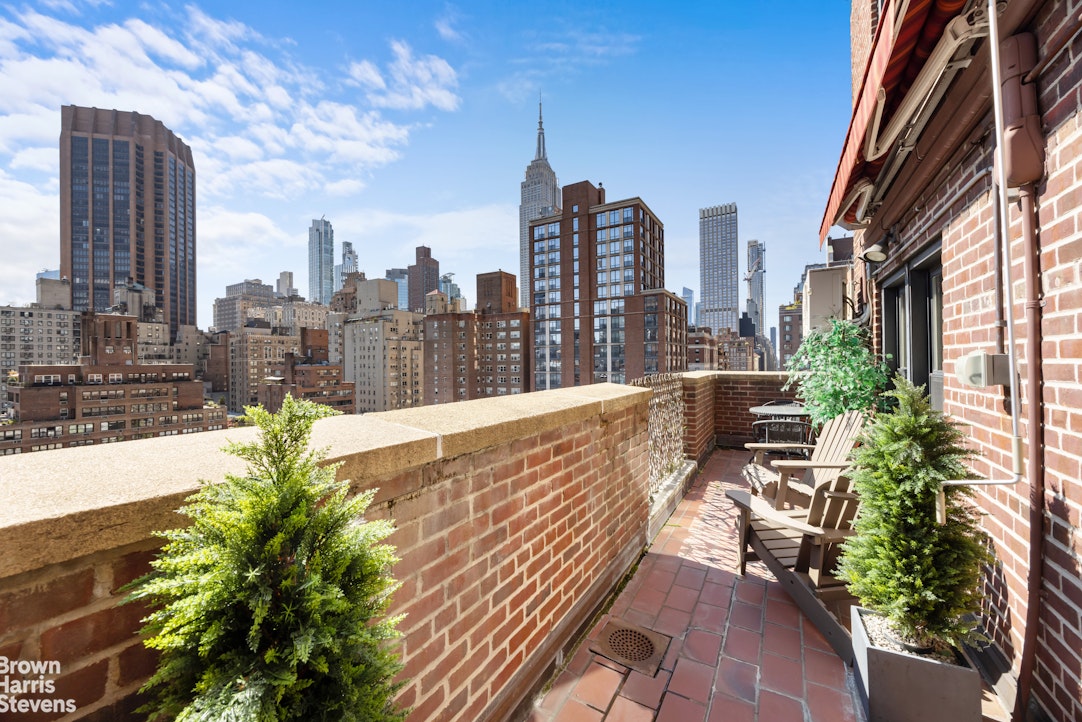 123 East 37th Street, Unit 14C Manhattan, NY 10016 - Photo 2 of 14 a view of a city with tall buildings