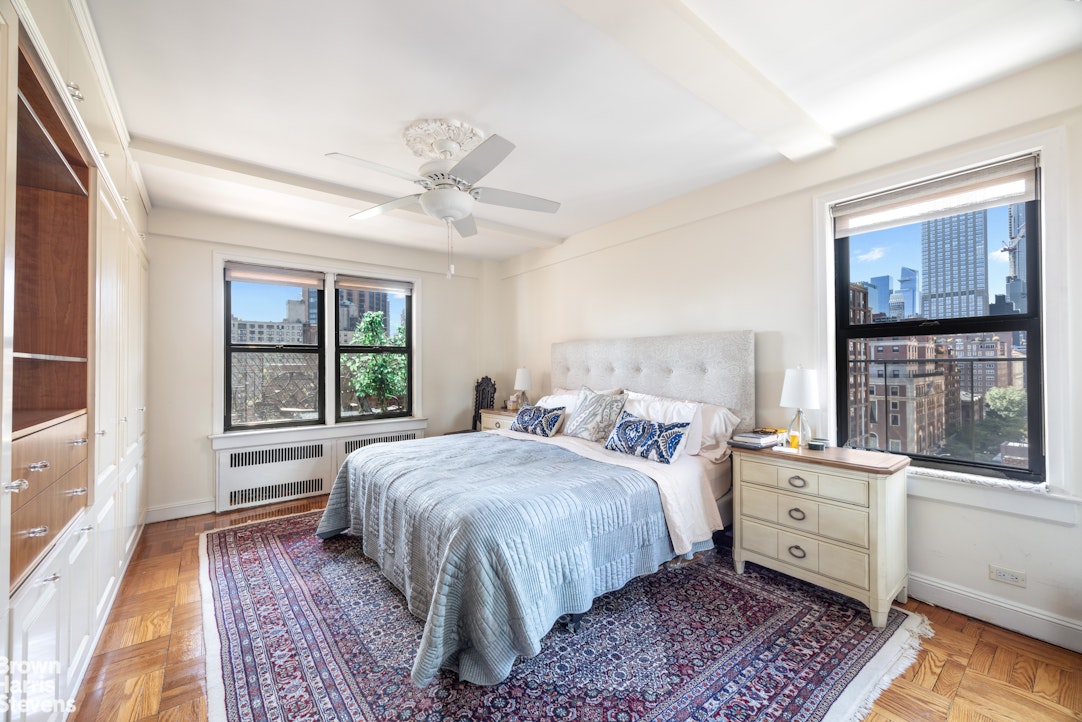 123 East 37th Street, Unit 14C Manhattan, NY 10016 - Photo 7 of 14 a bedroom with a large bed and a window