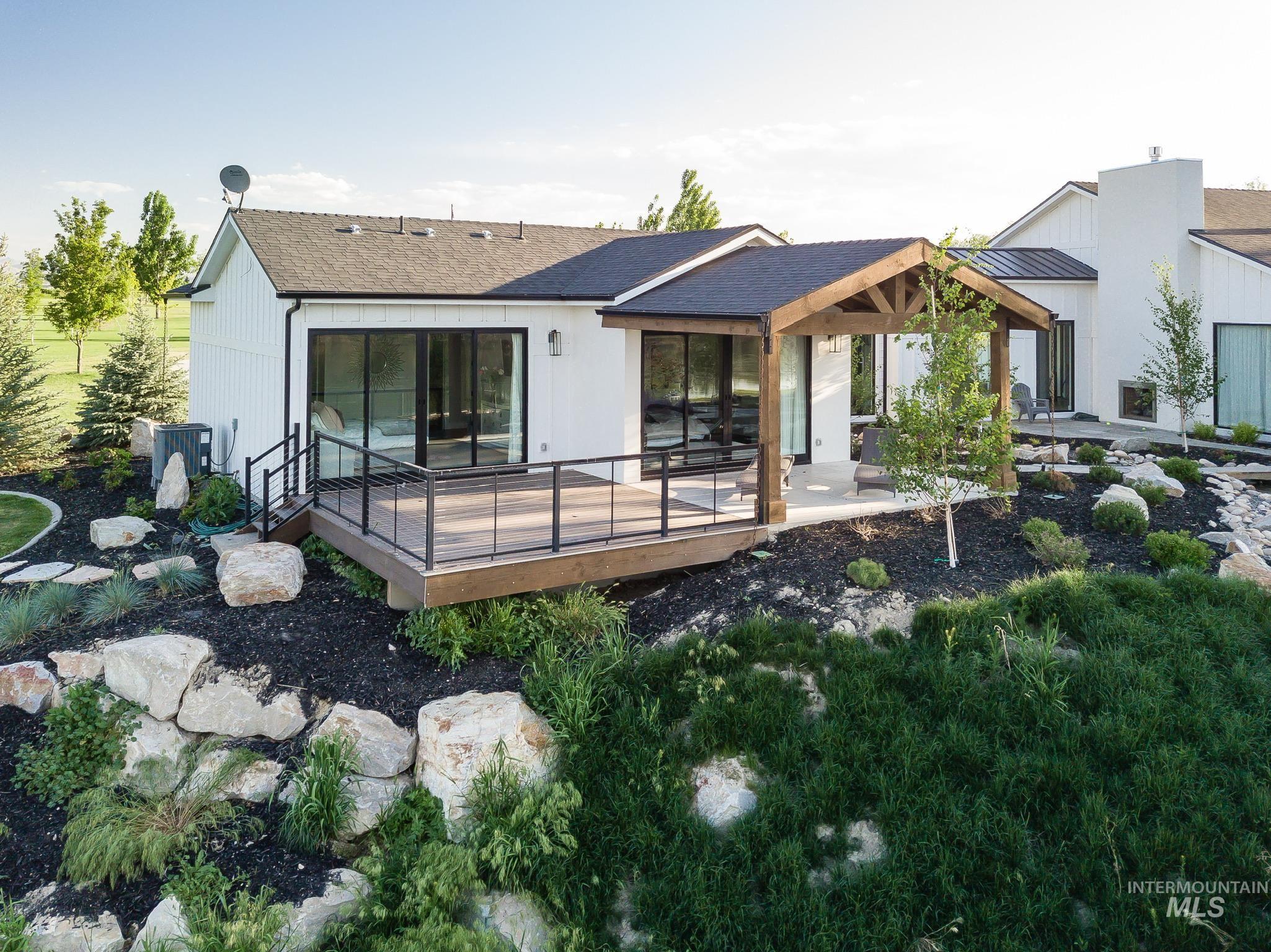 2475 River Ranch Emmett, ID 83617 - Photo 11 of 15 Back of house featuring a deck and roof with shingles