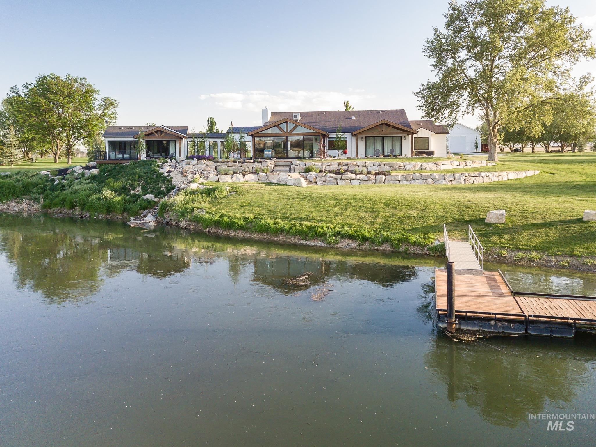 2475 River Ranch Emmett, ID 83617 - Photo 14 of 15 Dock featuring a water view and a lawn