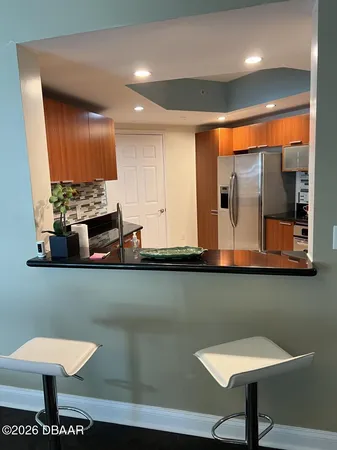 a view of a chairs and table in a kitchen
