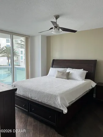 a bed sitting in a bedroom next to a window