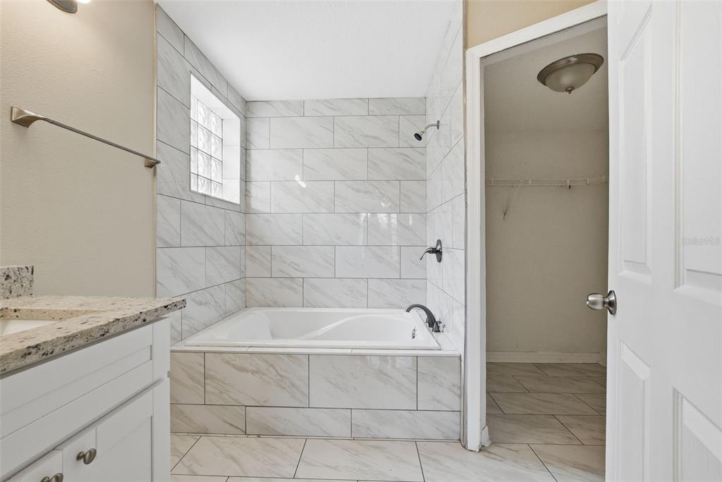 617 Greys Ferry Road Orlando, FL 32811 - Photo 25 of 35 a bathroom with a bathtub and shower