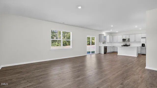 a view of kitchen with wooden floor and windows