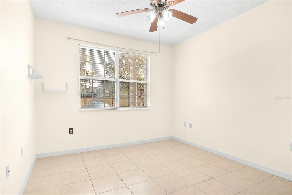 10873 Windsor Walk Drive, Unit 4106 Orlando, FL 32837 - Photo 15 of 30 an empty room with a window