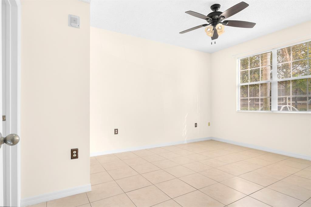 10873 Windsor Walk Drive, Unit 4106 Orlando, FL 32837 - Photo 17 of 30 a view of an empty room with a window