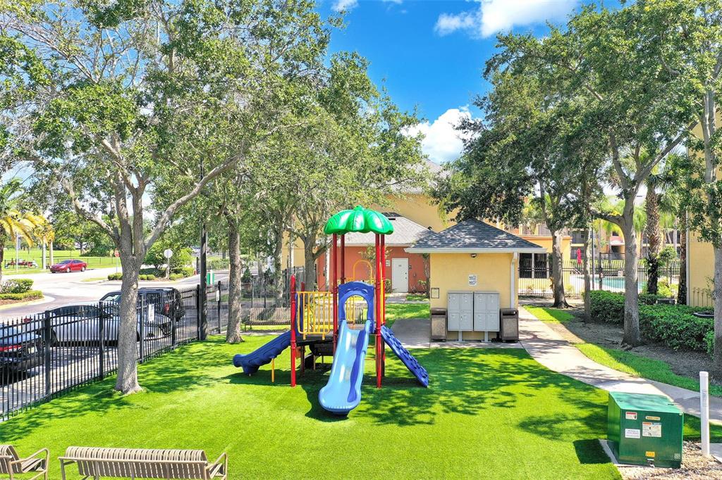 10873 Windsor Walk Drive, Unit 4106 Orlando, FL 32837 - Photo 23 of 30 a view of a house with a park