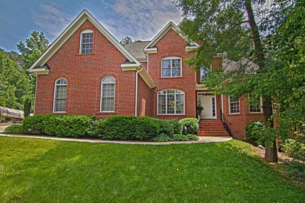 Beautifully landscaped all brick home on nearly one acre! Exterior Front