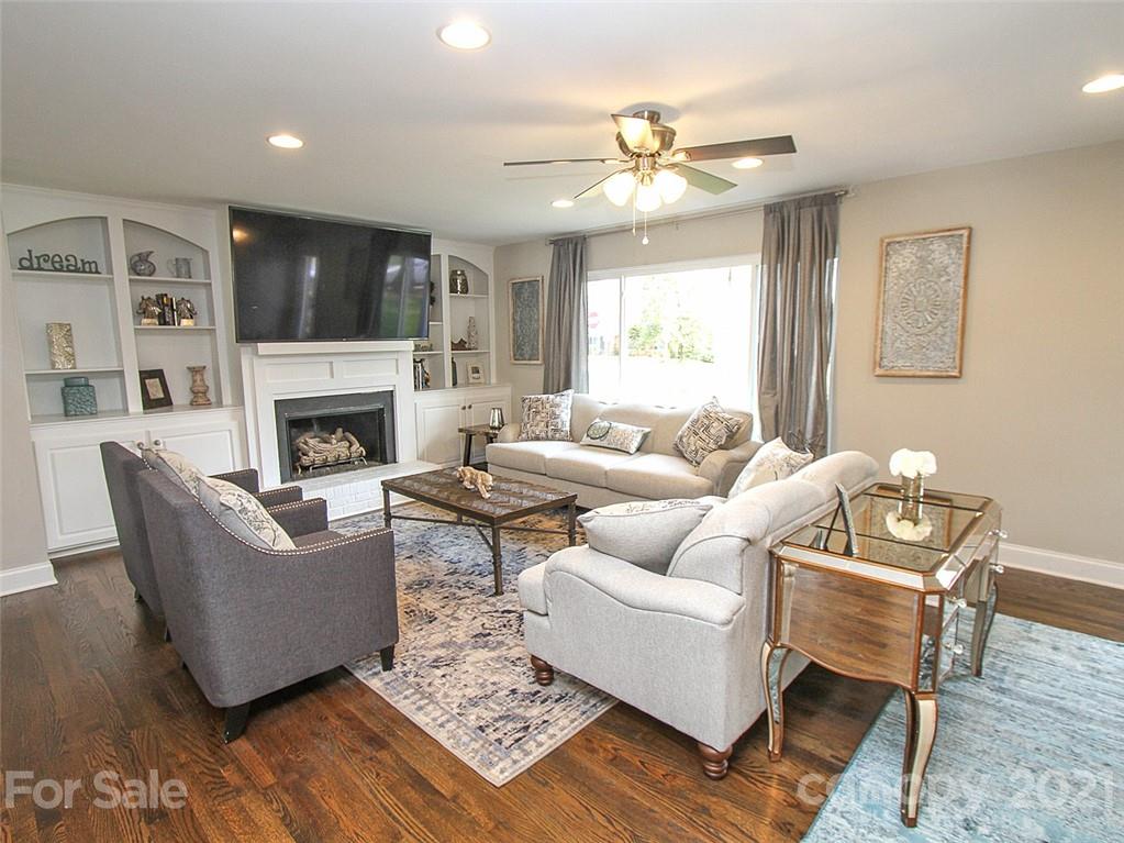 405 Fieldstone Road Mooresville, NC 28115 - Photo 12 of 46 a living room with furniture and a fireplace