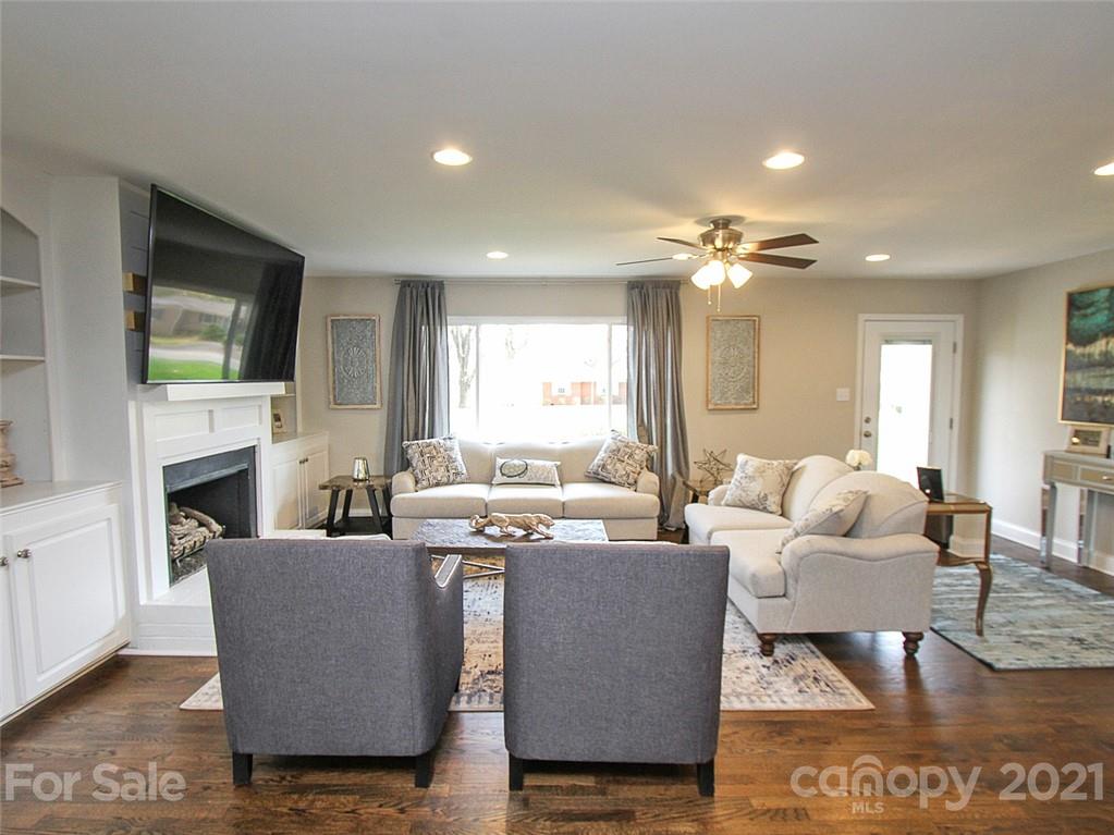 405 Fieldstone Road Mooresville, NC 28115 - Photo 14 of 46 a living room with fireplace furniture and a flat screen tv