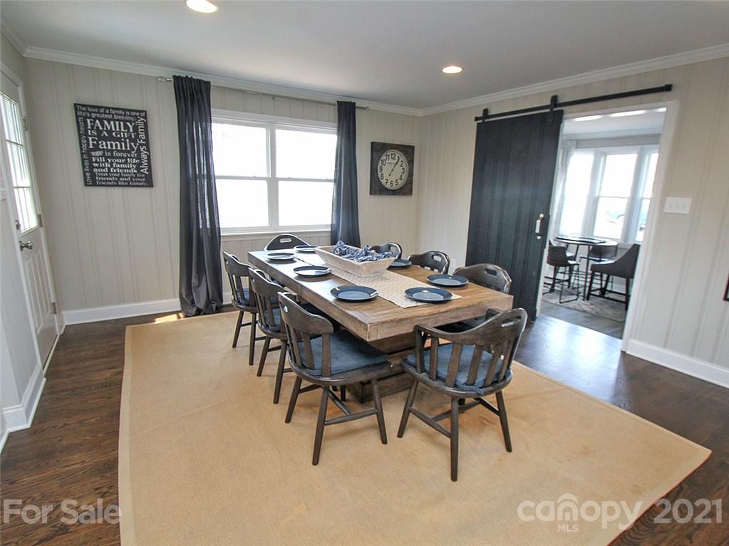 405 Fieldstone Road Mooresville, NC 28115 - Photo 16 of 46 a view of a dining room with furniture and wooden floor
