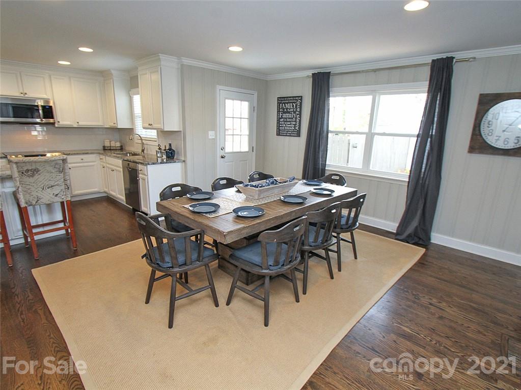 405 Fieldstone Road Mooresville, NC 28115 - Photo 17 of 46 a view of a dining room with furniture and wooden floor