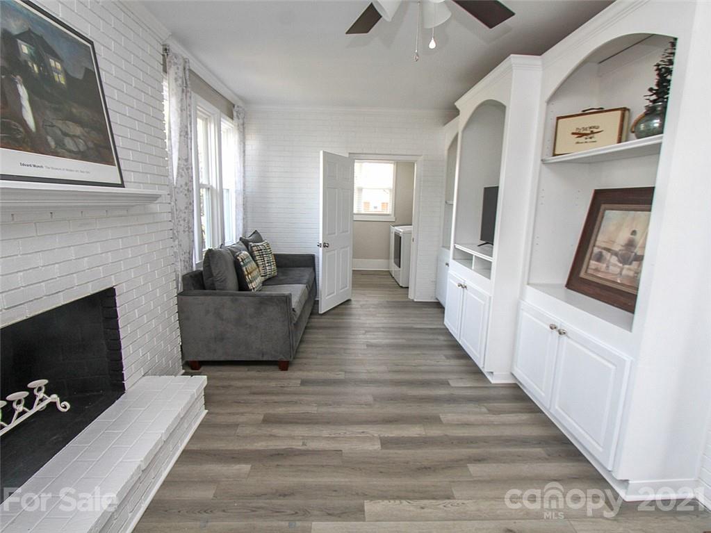 405 Fieldstone Road Mooresville, NC 28115 - Photo 22 of 46 a living room with furniture and a fireplace or television
