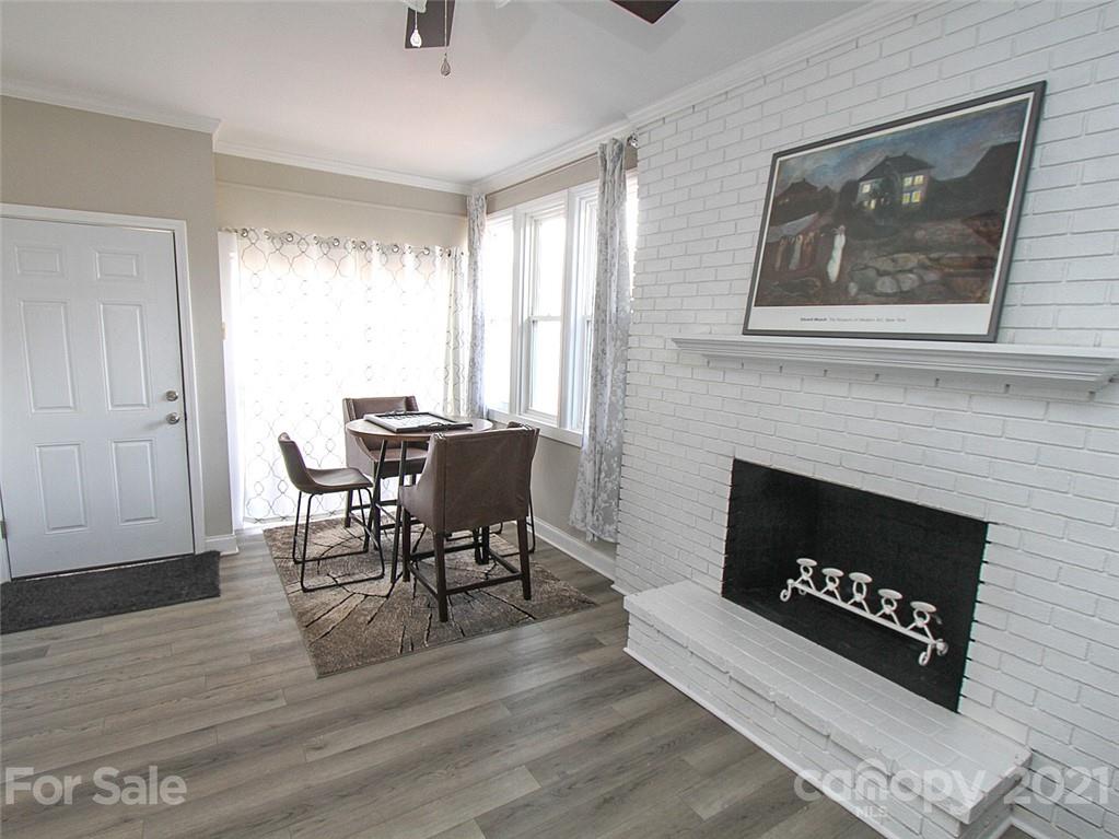 405 Fieldstone Road Mooresville, NC 28115 - Photo 23 of 46 a living room with furniture a fireplace and a window