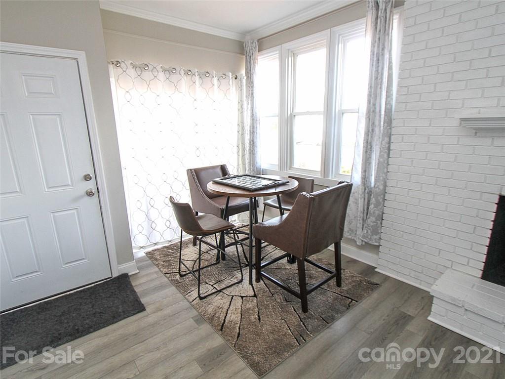 405 Fieldstone Road Mooresville, NC 28115 - Photo 24 of 46 a view of a dining room with furniture and wooden floor