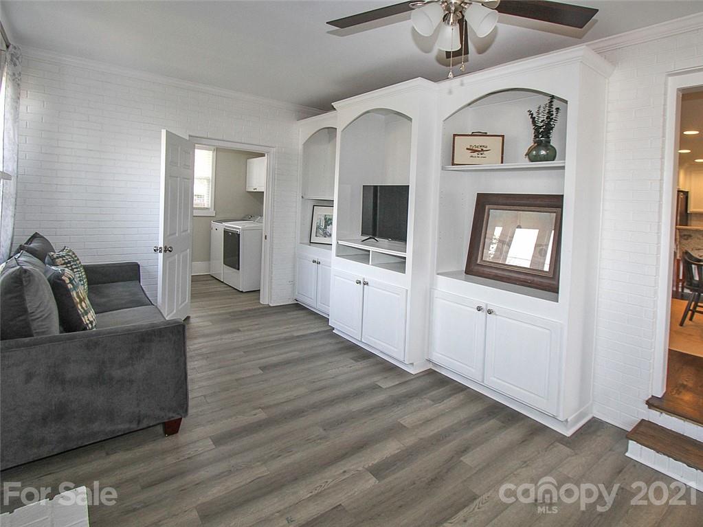 405 Fieldstone Road Mooresville, NC 28115 - Photo 25 of 46 a living room with furniture and a flat screen tv