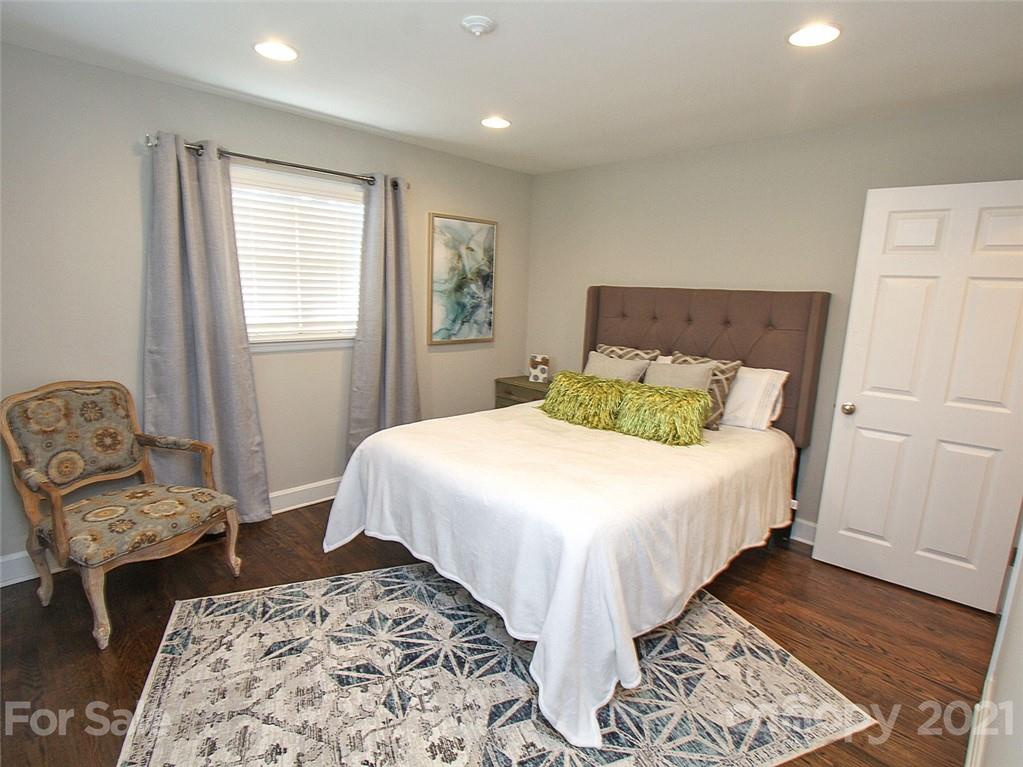 405 Fieldstone Road Mooresville, NC 28115 - Photo 29 of 46 a bedroom with a bed and wooden floor