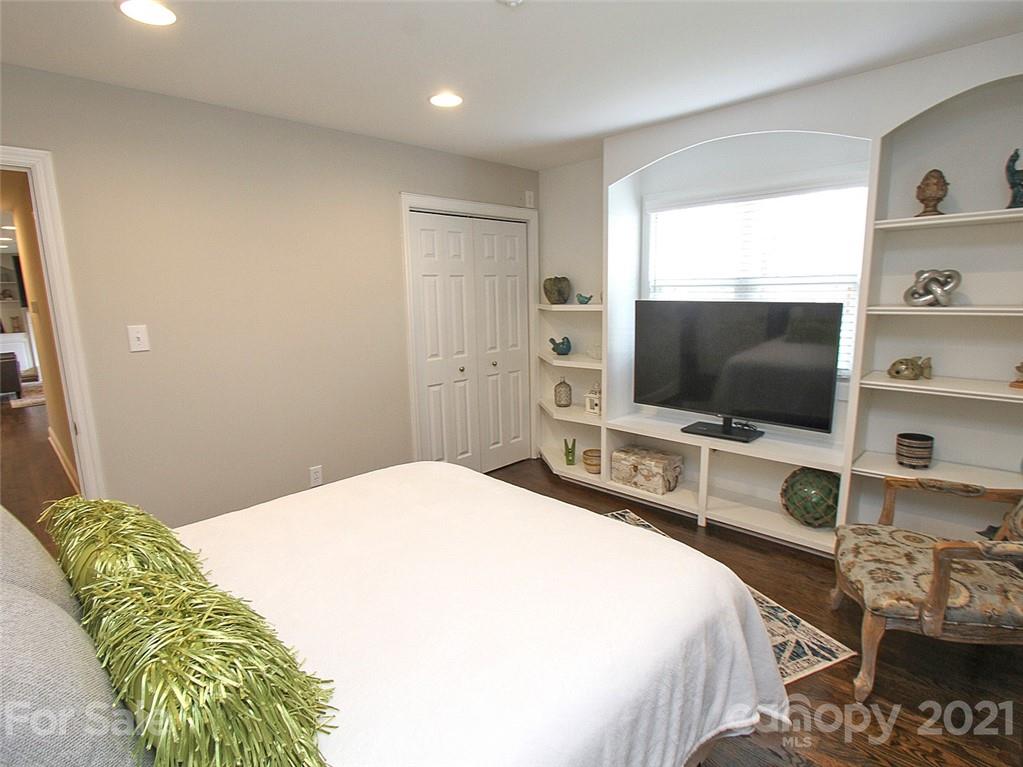 405 Fieldstone Road Mooresville, NC 28115 - Photo 30 of 46 a bedroom with a bed and a flat screen tv