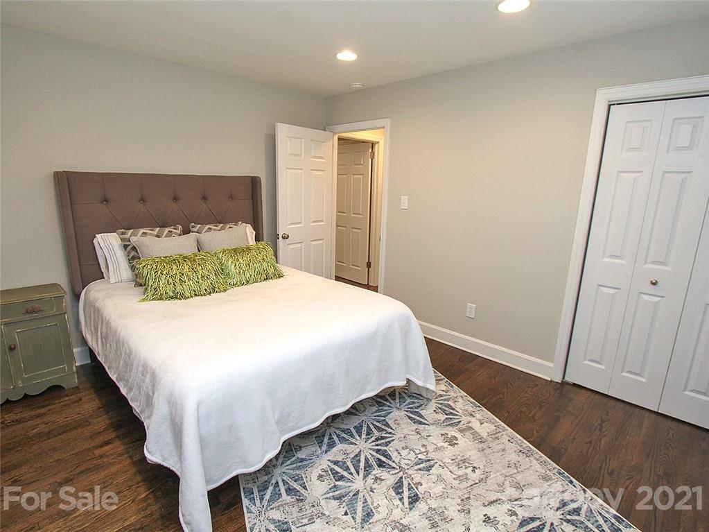 405 Fieldstone Road Mooresville, NC 28115 - Photo 31 of 46 a bedroom with a bed and wooden floor