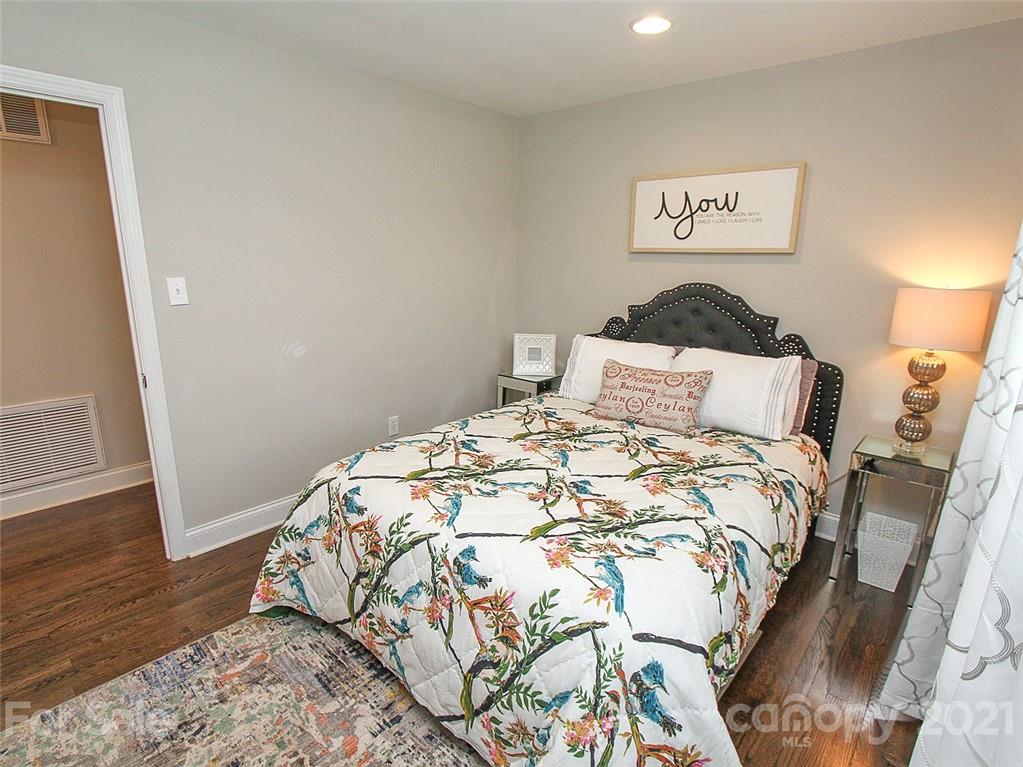 405 Fieldstone Road Mooresville, NC 28115 - Photo 33 of 46 a bedroom with a bed and wooden floor