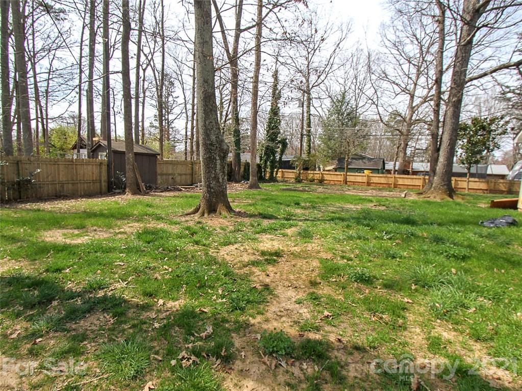 405 Fieldstone Road Mooresville, NC 28115 - Photo 42 of 46 a view of a backyard with large trees
