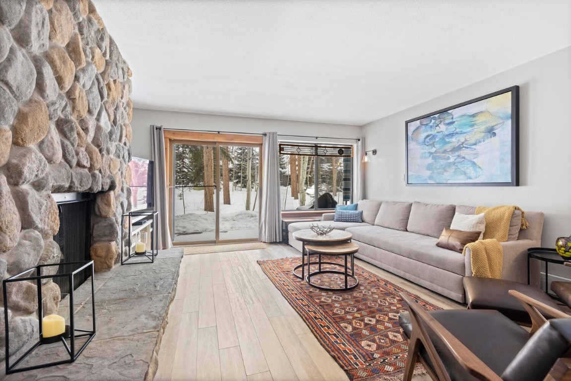 1928 Soda Ridge Road, Unit 1226 Keystone, CO 80435 - Photo 1 of 34 a living room with furniture and a fireplace