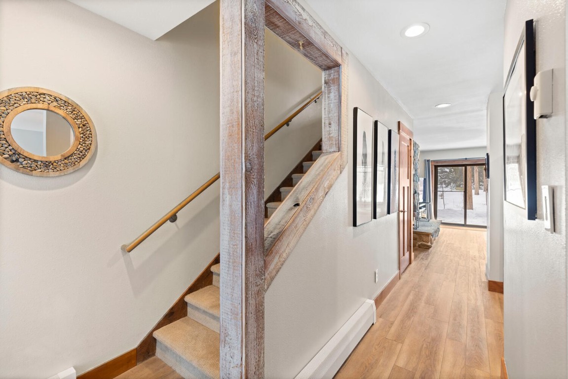 1928 Soda Ridge Road, Unit 1226 Keystone, CO 80435 - Photo 20 of 34 a view of a hallway with wooden floor and staircase