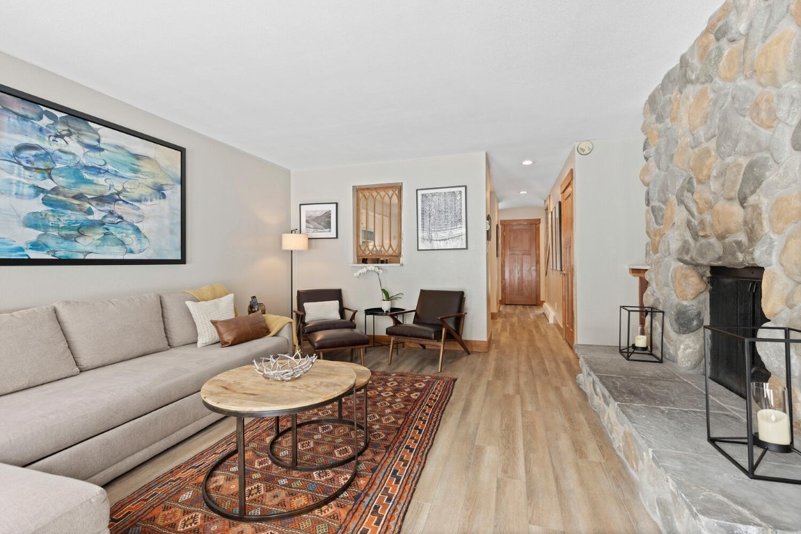 1928 Soda Ridge Road, Unit 1226 Keystone, CO 80435 - Photo 2 of 34 a living room with furniture and a dining table with rug