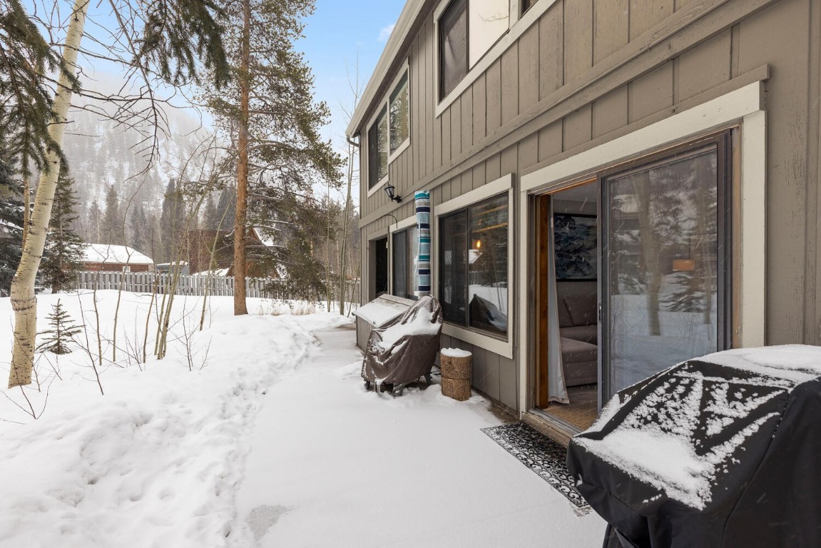 1928 Soda Ridge Road, Unit 1226 Keystone, CO 80435 - Photo 31 of 34 a view of a patio with a snow on the road