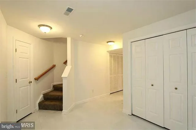a bathroom with a sink mirror toilet and bathtub