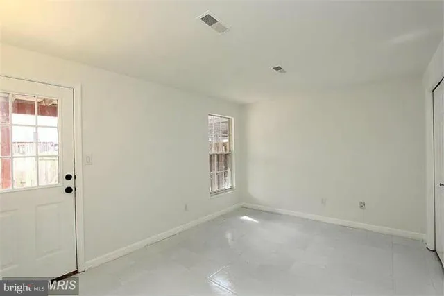 a view of a balcony with furniture