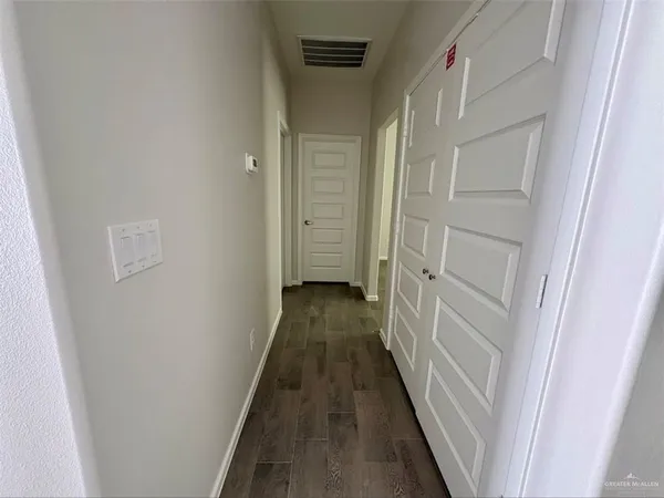 a view of a bathroom from the hallway
