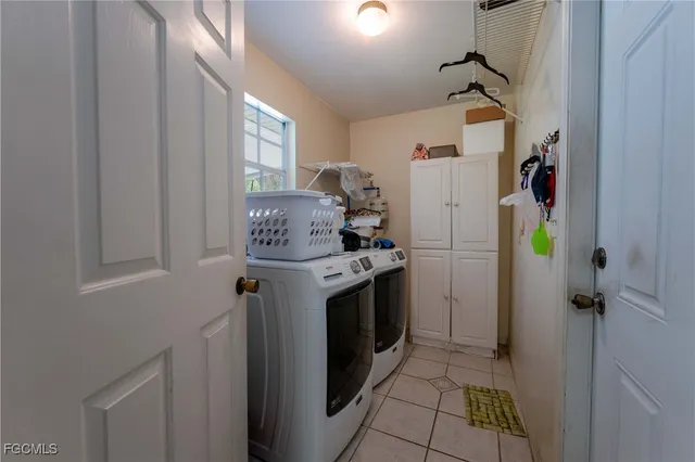 a utility room with closet dryer and washer