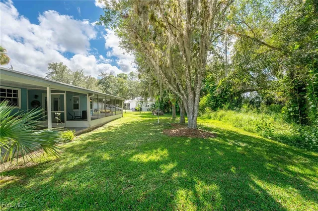 a view of backyard with green space