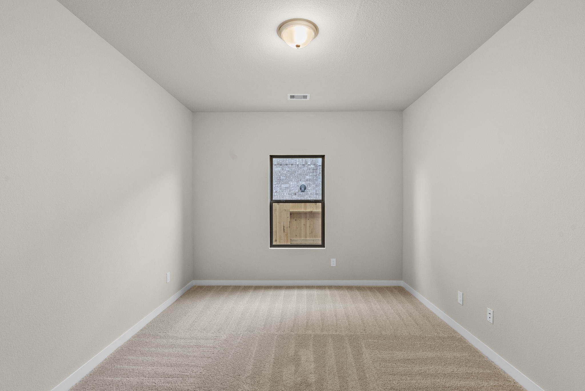 1911 Stargazer Lane Angleton, TX 77515 - Photo 15 of 33 an empty room with a window and closet