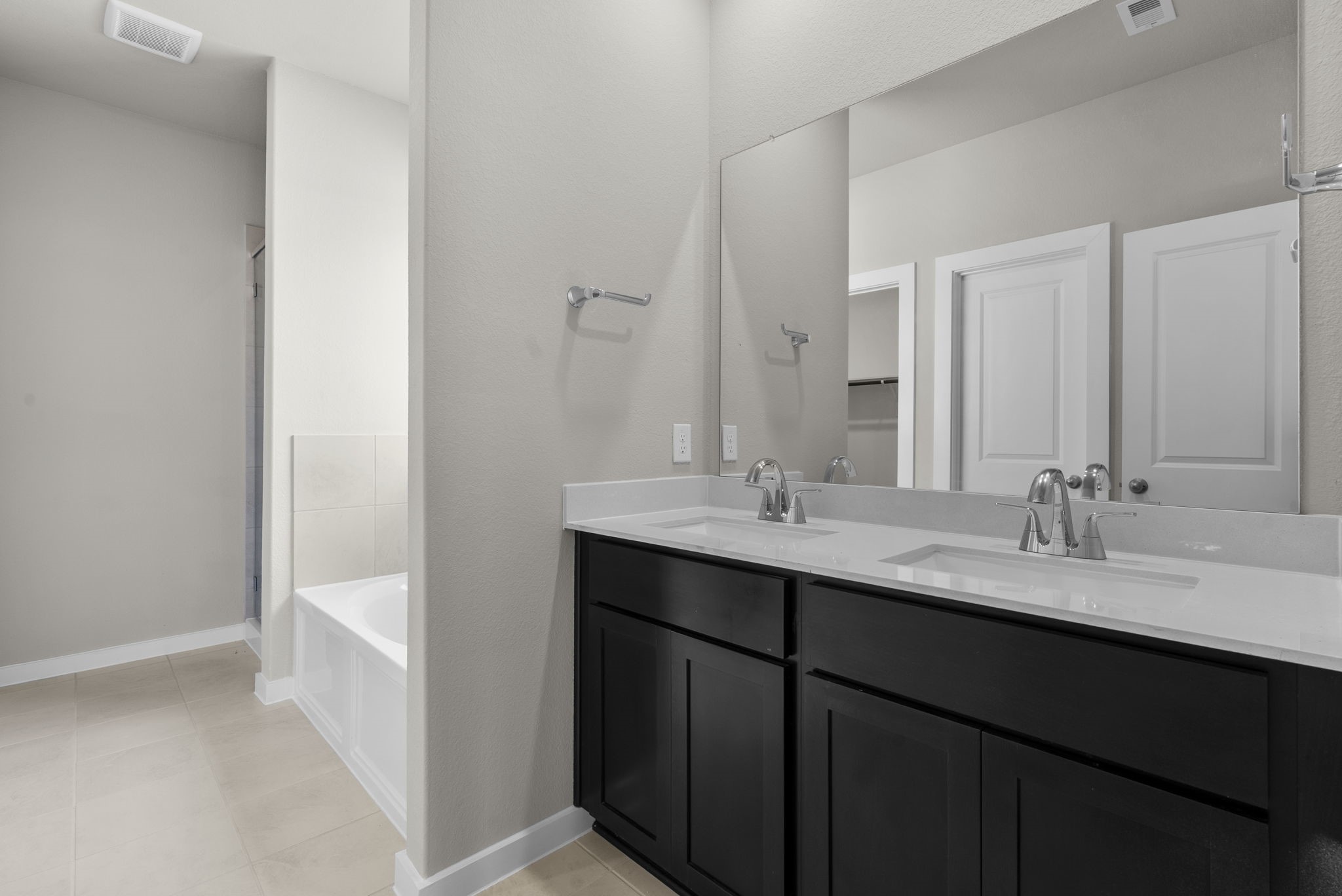 1911 Stargazer Lane Angleton, TX 77515 - Photo 19 of 33 a bathroom with a double vanity sink and a mirror