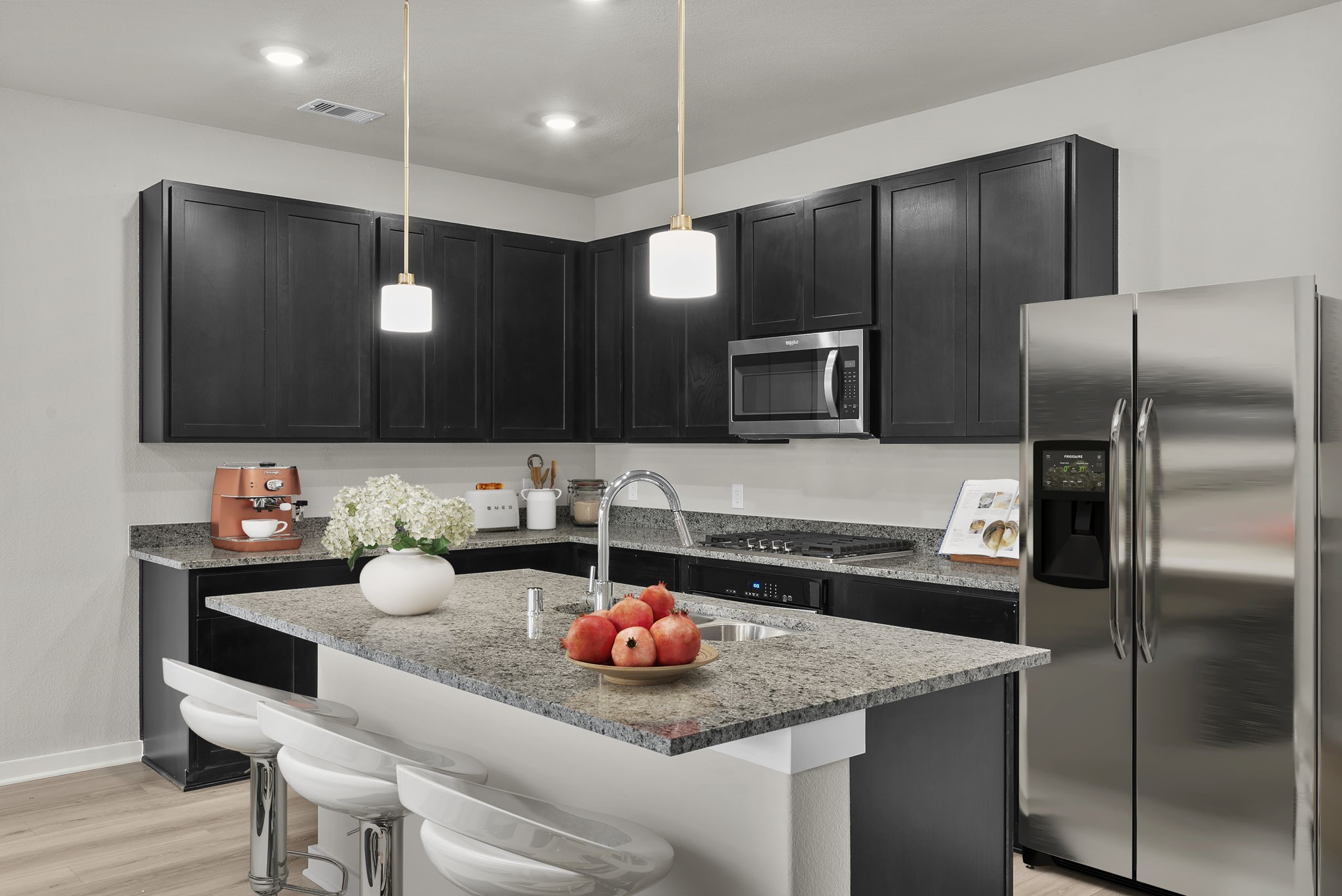 1911 Stargazer Lane Angleton, TX 77515 - Photo 2 of 33 a kitchen with a refrigerator and a sink