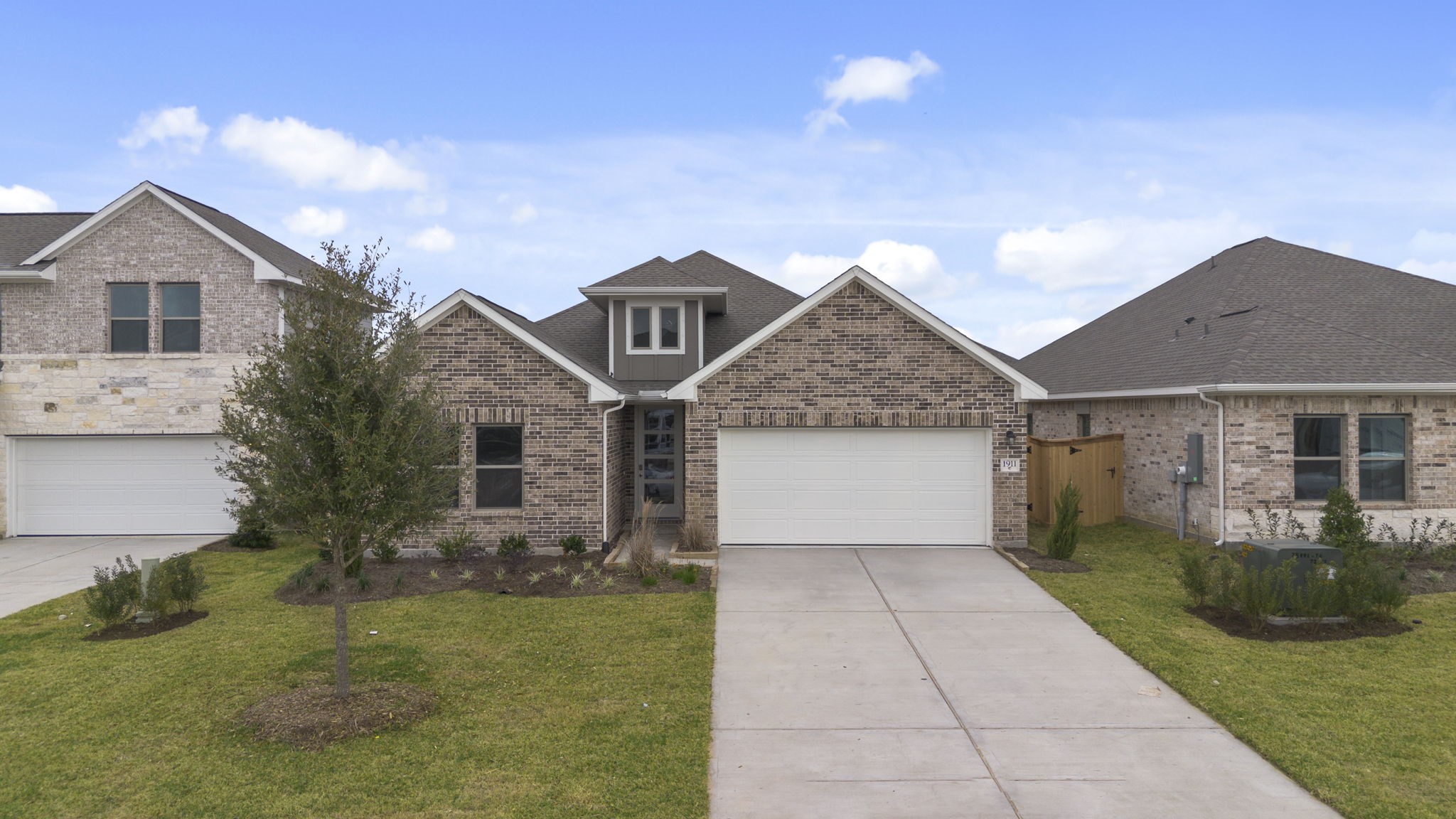 1911 Stargazer Lane Angleton, TX 77515 - Photo 26 of 33 a front view of house with yard and green space