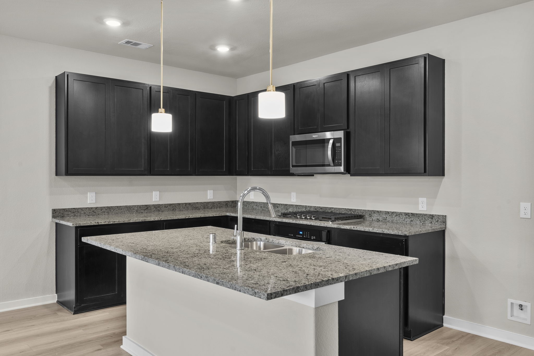 1911 Stargazer Lane Angleton, TX 77515 - Photo 3 of 33 a kitchen with a sink a microwave and refrigerator