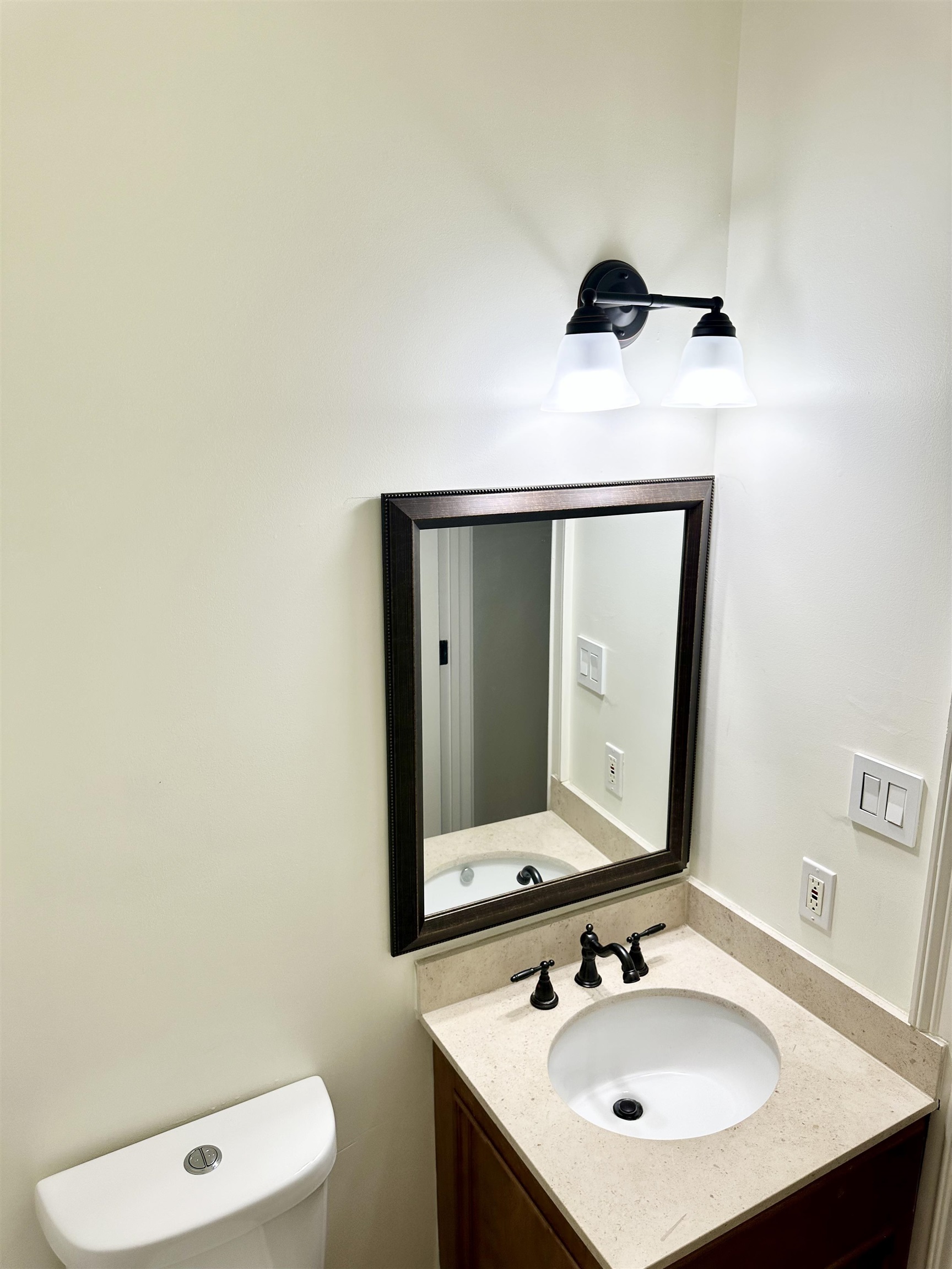 205 Jamerson Farm Road Collierville, TN 38017 - Photo 23 of 36 a bathroom with a sink and a mirror