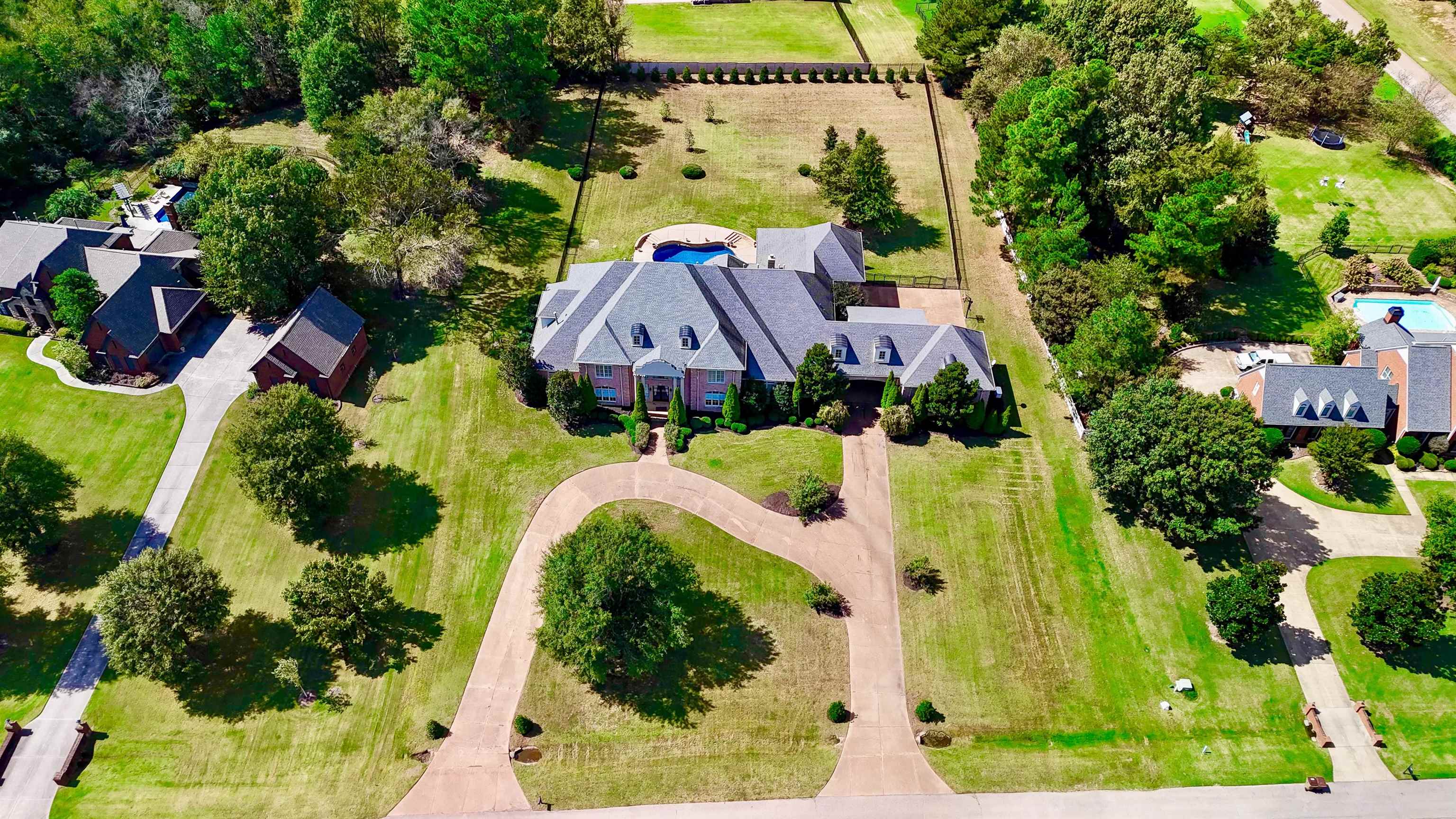 205 Jamerson Farm Road Collierville, TN 38017 - Photo 33 of 36 a view of swimming pool with a garden
