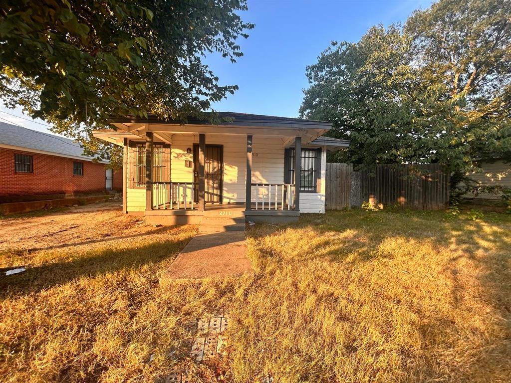 2710 Mitchell Street Dallas, TX 75210 - Photo 15 of 15 Back of property featuring a porch and a yard