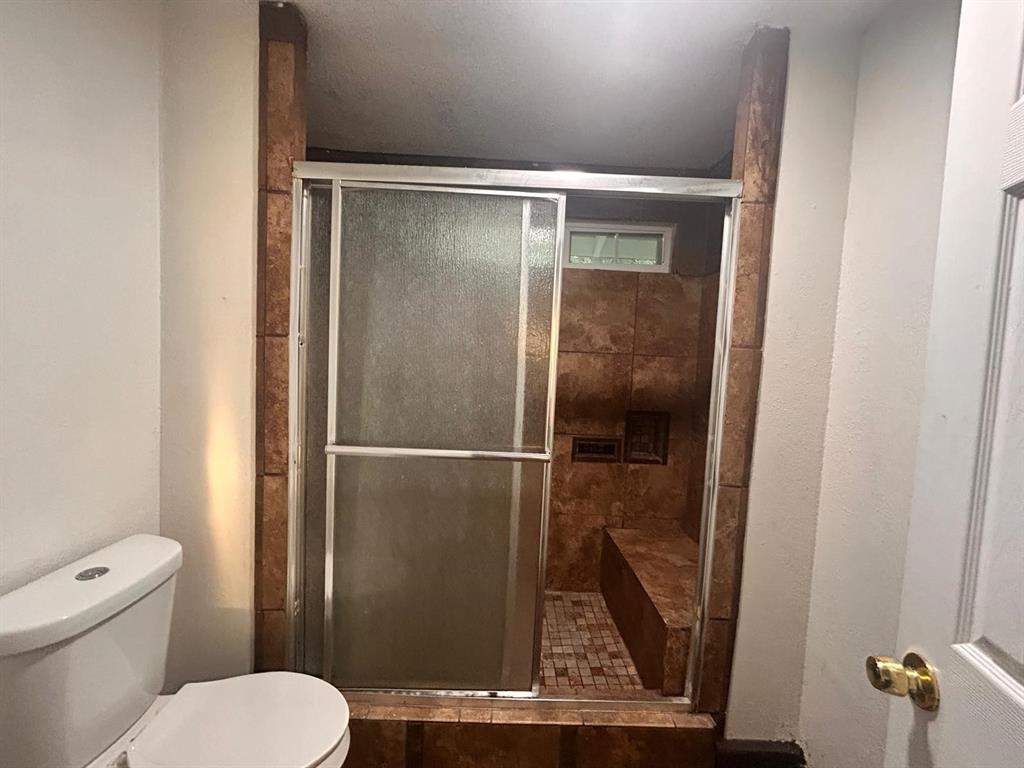 2710 Mitchell Street Dallas, TX 75210 - Photo 10 of 15 Full bath with toilet and a shower stall