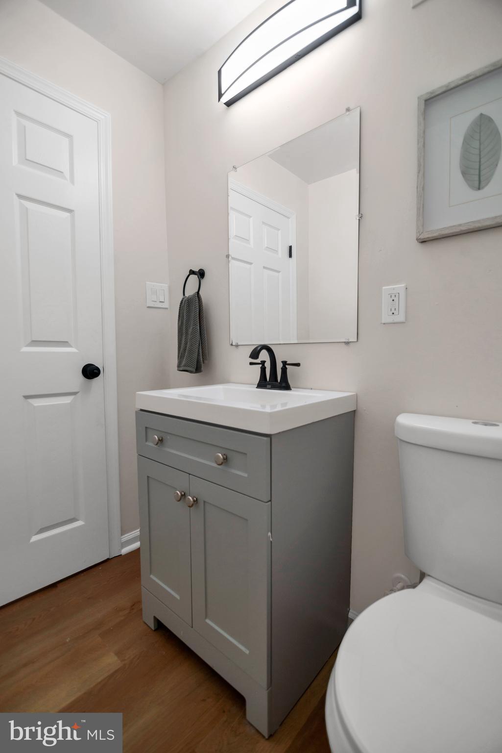 4132 Marx Avenue Baltimore, MD 21206 - Photo 25 of 76 a bathroom with a sink a toilet and mirror