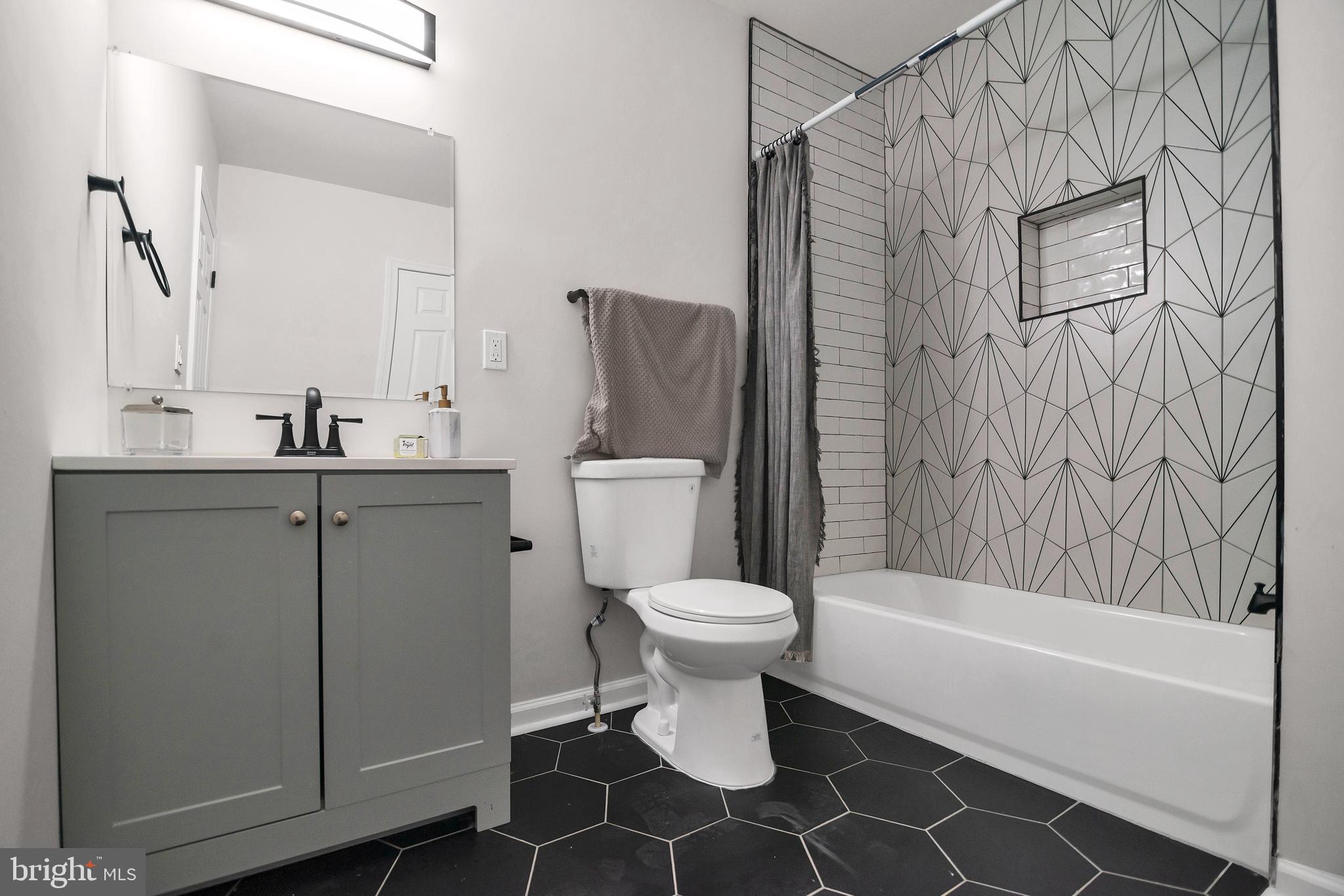 4132 Marx Avenue Baltimore, MD 21206 - Photo 39 of 76 a bathroom with a sink toilet and shower