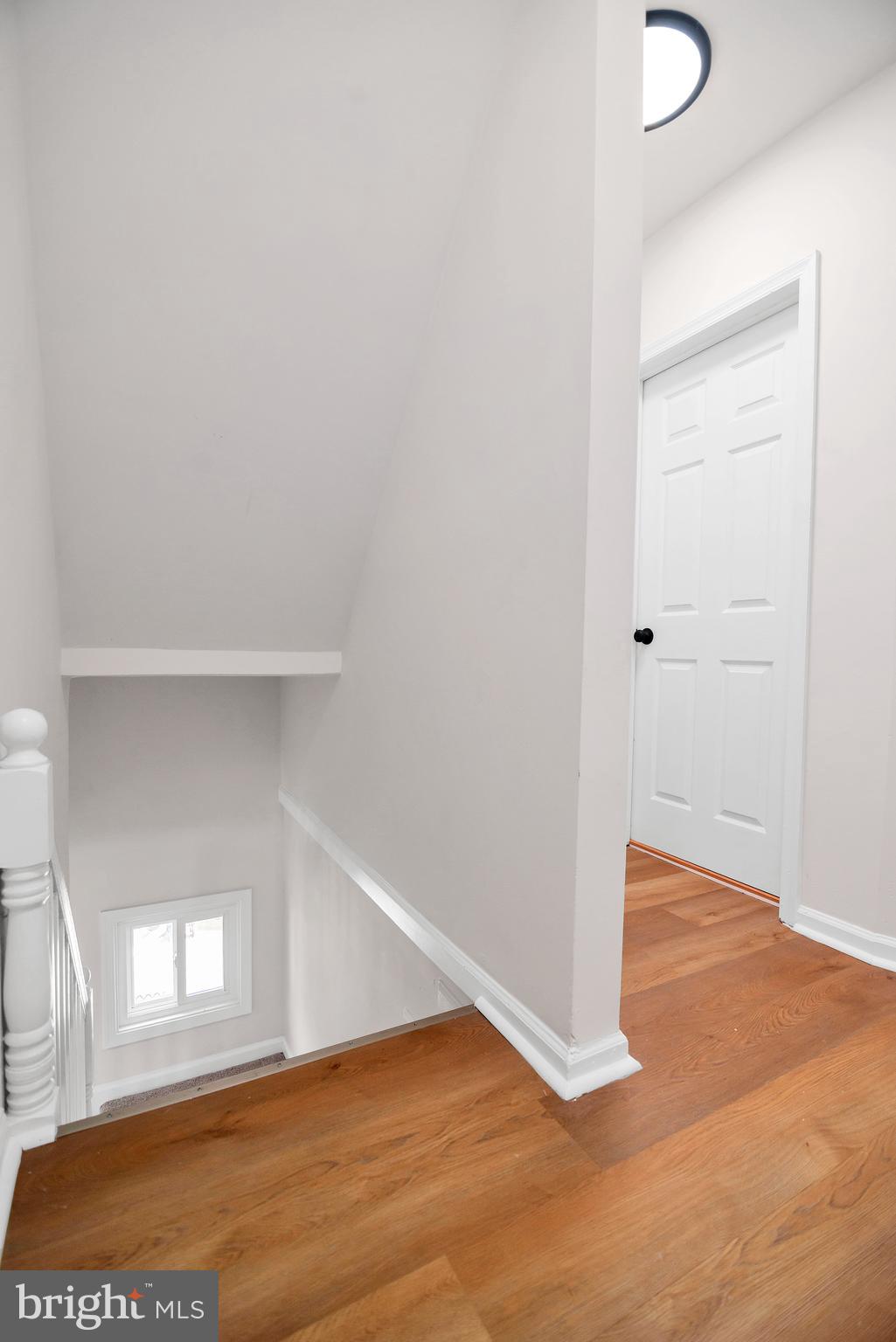 4132 Marx Avenue Baltimore, MD 21206 - Photo 46 of 76 a view of an empty room with wooden floor and a window