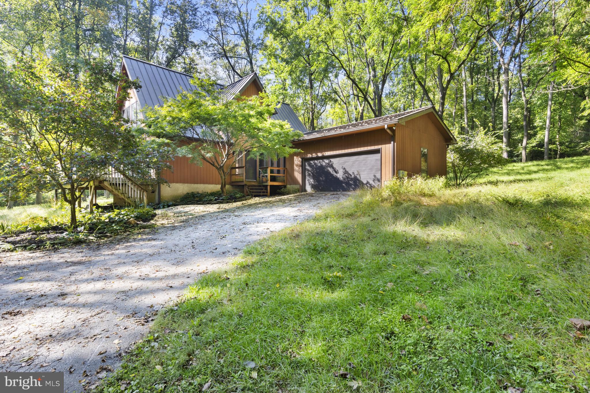 570 Chandler Mill Road Avondale, PA 19311 - Photo 1 of 41 a backyard of a house with lots of green space
