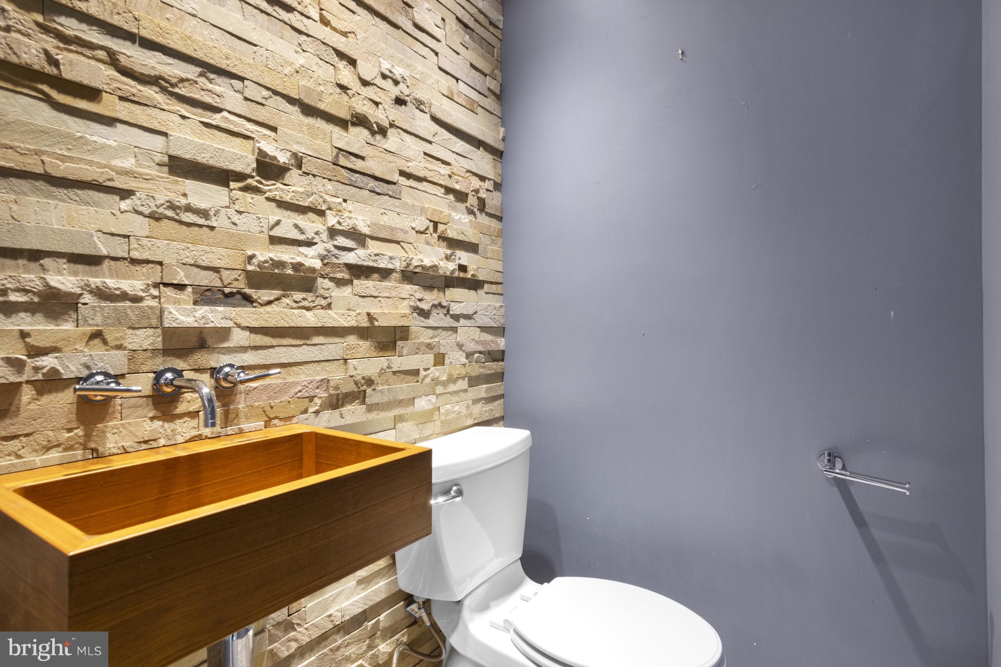 570 Chandler Mill Road Avondale, PA 19311 - Photo 23 of 41 a bathroom with a sink a toilet and a mirror