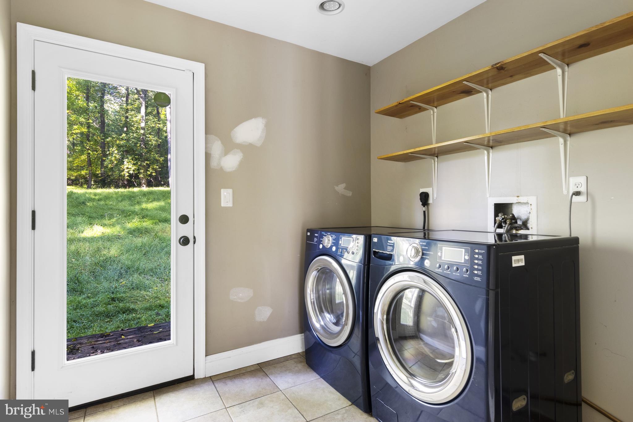 570 Chandler Mill Road Avondale, PA 19311 - Photo 24 of 41 a view of storage and utility room with washer and dryer