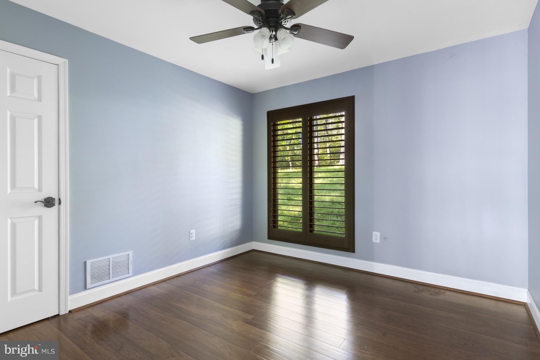 570 Chandler Mill Road Avondale, PA 19311 - Photo 25 of 41 a view of an empty room with wooden floor and a window